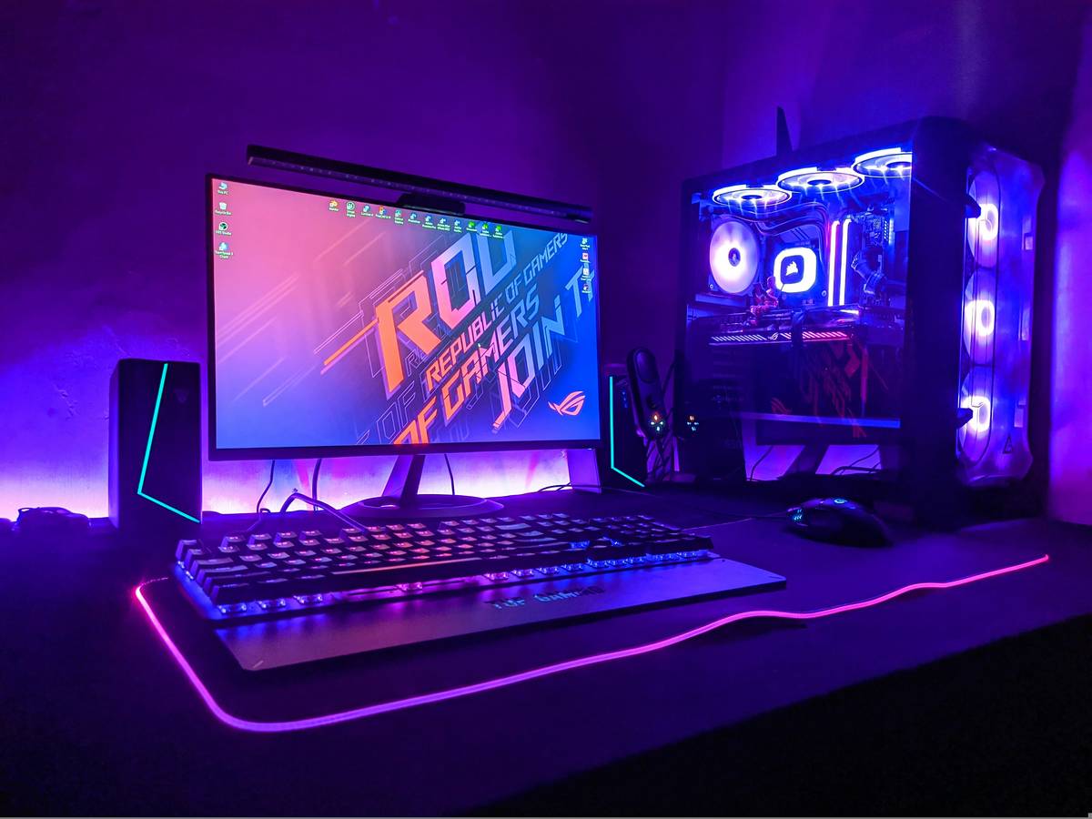 pc gaming bundle black friday featuring a pre-built gaming desktop with RGB lighting, keyboard, and mouse on a desk